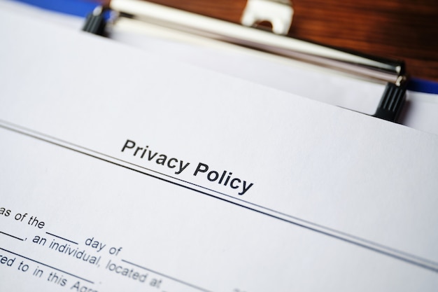 Photo legal document privacy policy on paper close up.