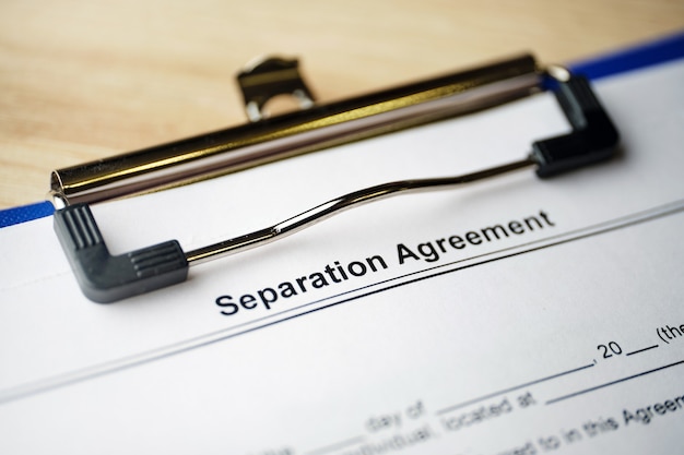 Legal document Separation Agreement on paper with pen.