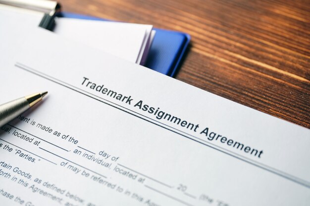 Legal document Trademark Assignment Agreement on paper close up.