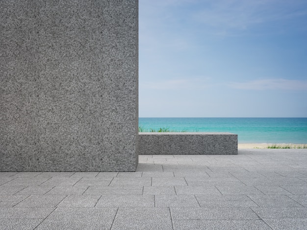 Lege grijze kiezelsteenmuur op buitenterras dichtbij tuin in modern strandhuis