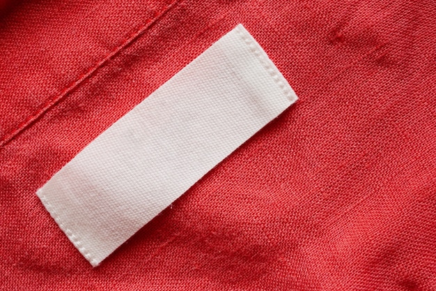 Lege kleding label label op linnen overhemd stof textuur achtergrond