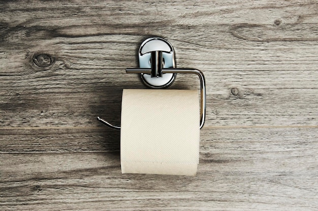 Lege toiletpapier rol houder achtergrond met kopie ruimte close-up