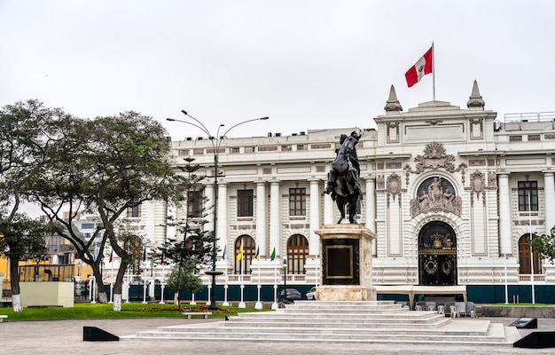 The legislative palace of peru with a statue of simon bolivar in lima