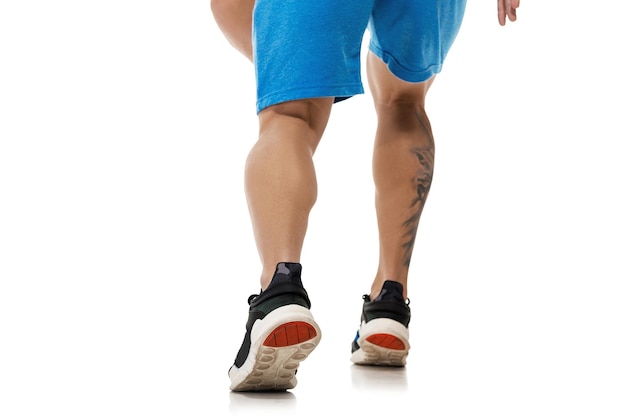 Photo legs of man running on white background