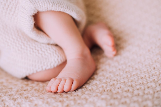 Legs of a newborn baby lifestyle A small child An article about newborns