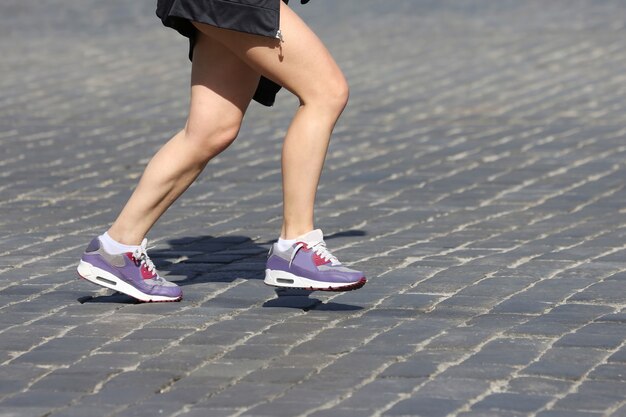 Photo legs running athletes on the course