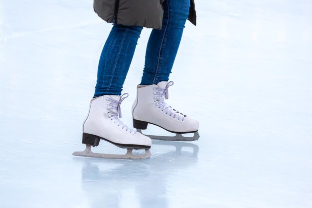 Legs of a skater on an ice rink hobbies and winter sports