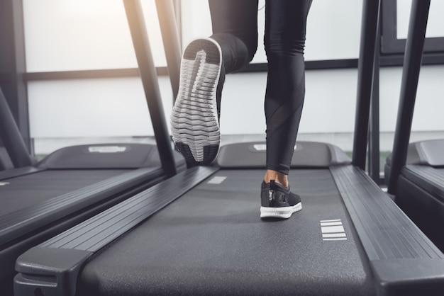 Legs woman running on treadmill