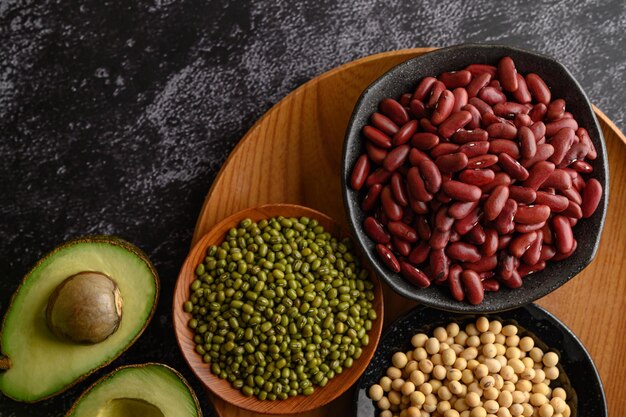 legumes and fruit on a black cement floor background