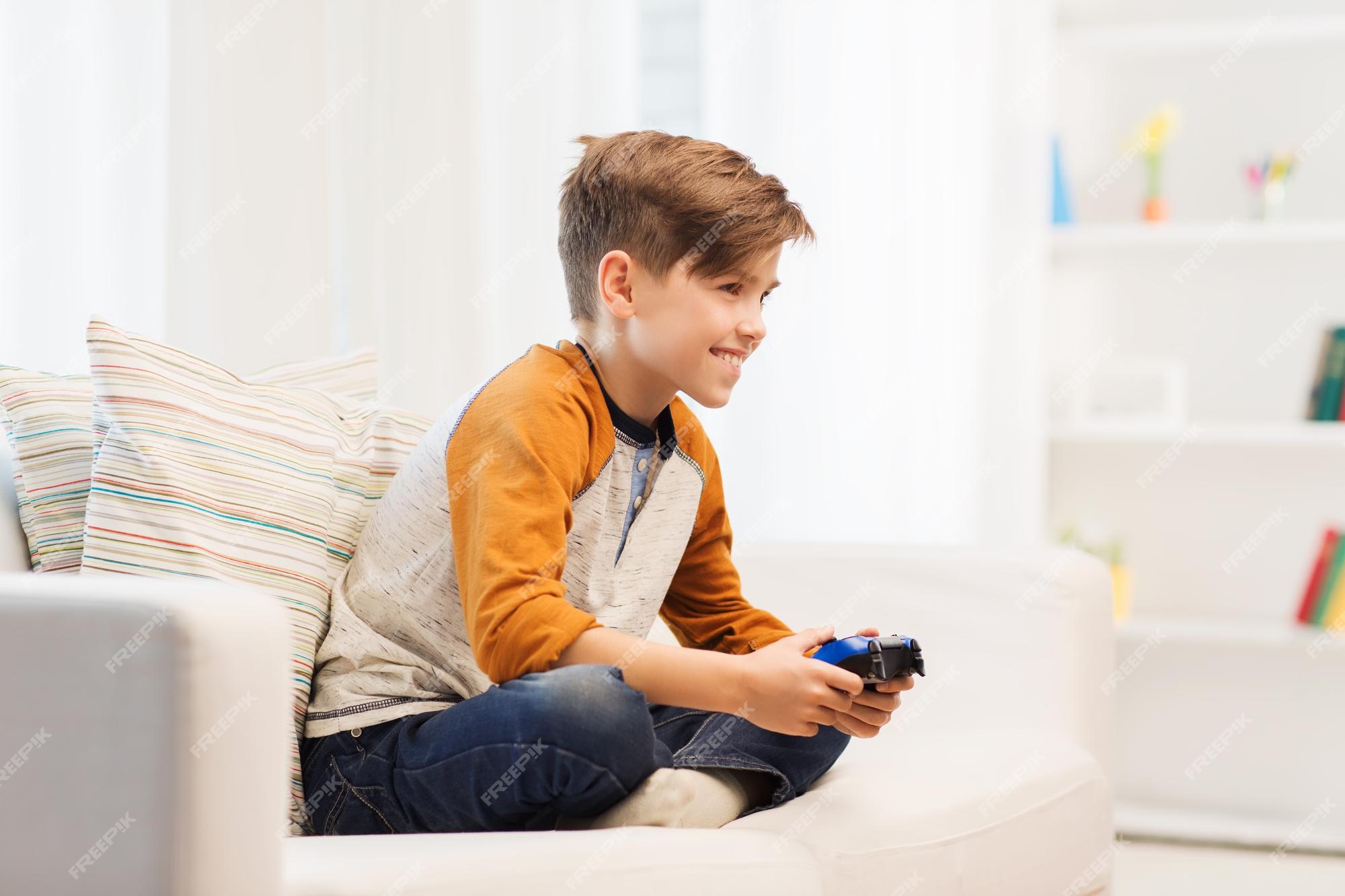 Smiling young child with video game controller Royalty-Free Stock Image -  Storyblocks