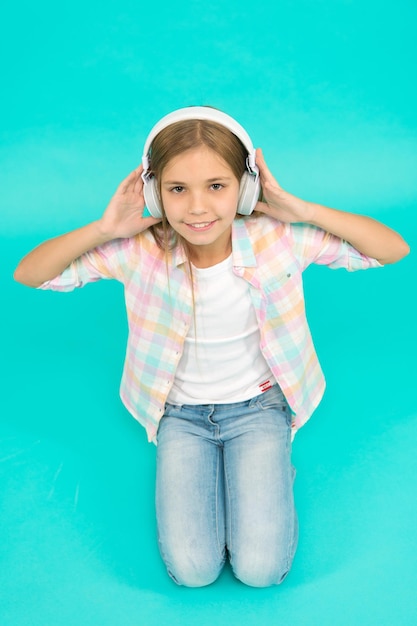 Leisure concept. Little girl listen song headphones. Enjoy track of favorite band. Girl child listen music modern headphones. Get music account subscription. Enjoy music concept. Music always with me.