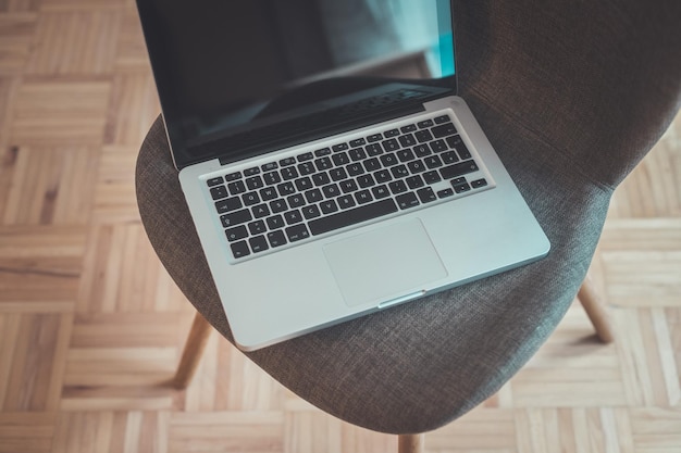 Leisure home office concept Laptop on vintage chair