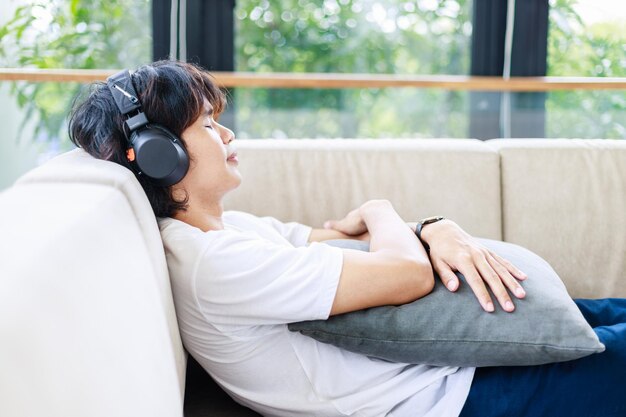 Leisure Time Man Listening to Music and Unwinding on a Cozy Couch