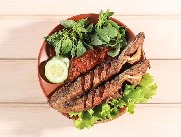 Lele Goreng or Fried Catfish is Traditional Indonesian Culinary Food. Catfish and Chilli Tomato Paste, Popular Street Food Called Pecel Lele Lamongan or Penyetan Lele