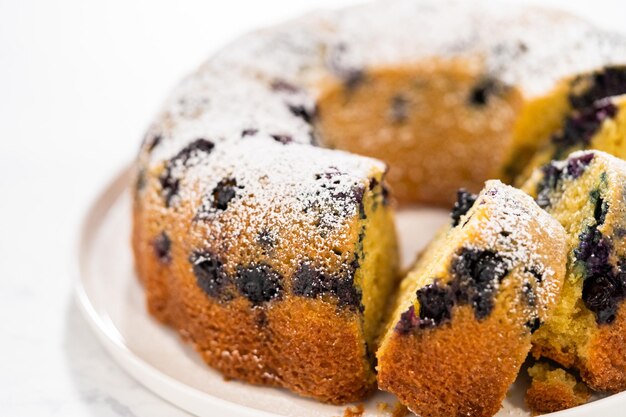 Lemon blueberry bundt cake with powdered sugar dusting