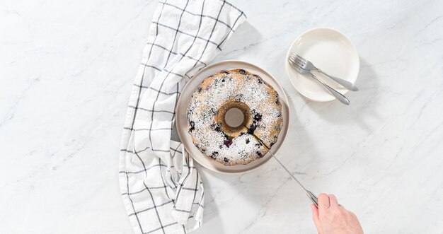 Lemon blueberry bundt cake with powdered sugar dusting