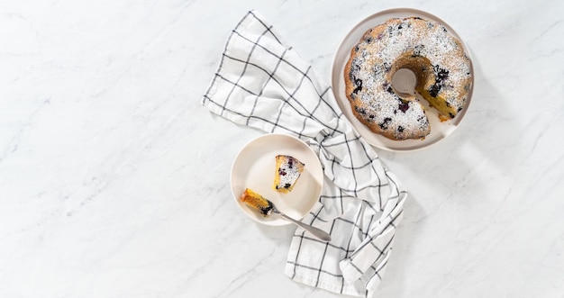 Lemon blueberry bundt cake with powdered sugar dusting