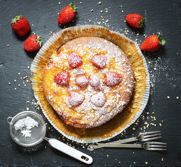 Lemon cake with strawberries, sugar end chocolate