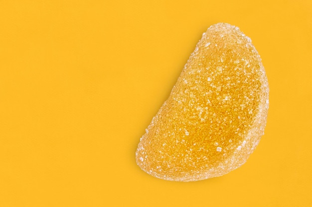 Lemon candy on yellow