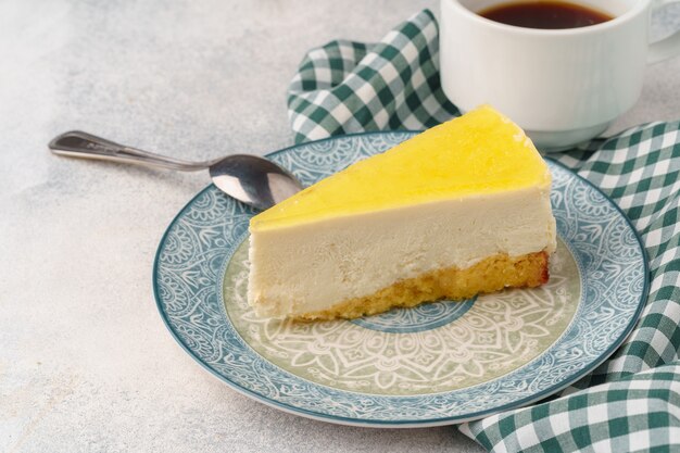 Lemon cheesecake on the plate close up