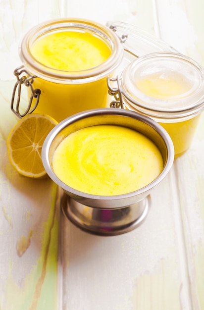 Lemon curd in glass jars on the table