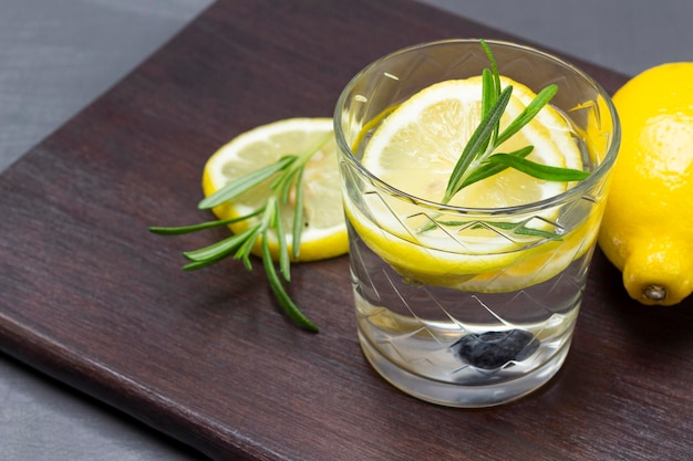 Lemon drink in a glass Lemon on the board