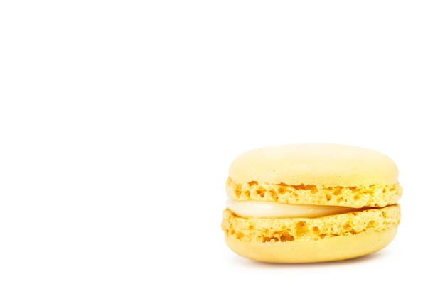 Lemon flavor macaron isolated on a white