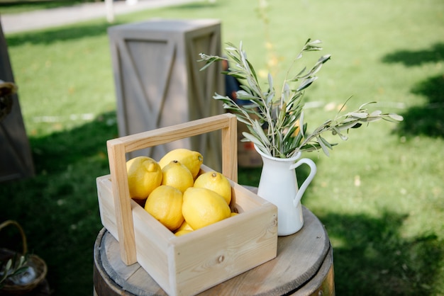 Lemon fruits in wooden basket on wooden table