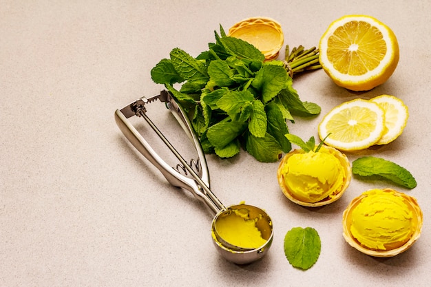 Lemon ice cream with mint on cones