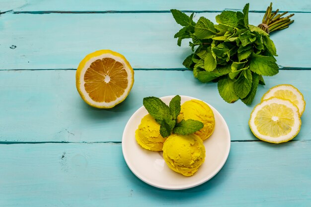 Lemon ice cream with mint on a plate