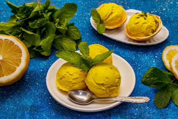 Lemon ice cream with mint on a plate