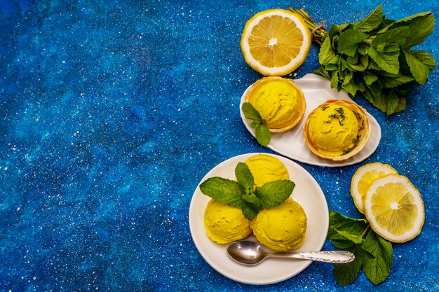 Lemon ice cream with mint on a plate