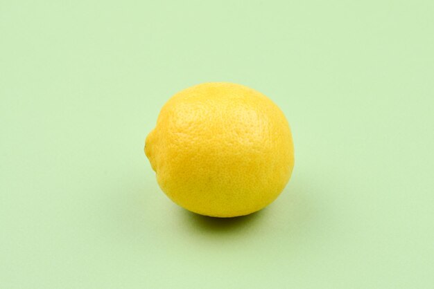 Lemon isolated on green background Space for test or design