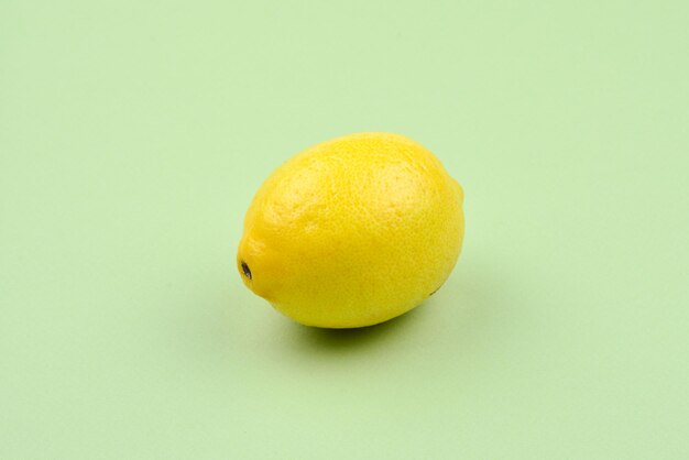 Lemon isolated on green background Space for test or design