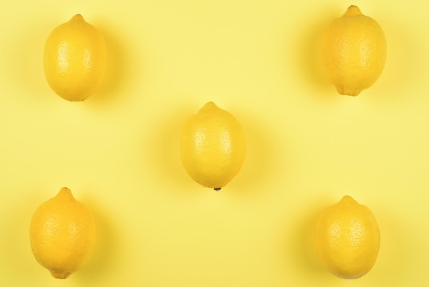 Lemon isolated on yellow background