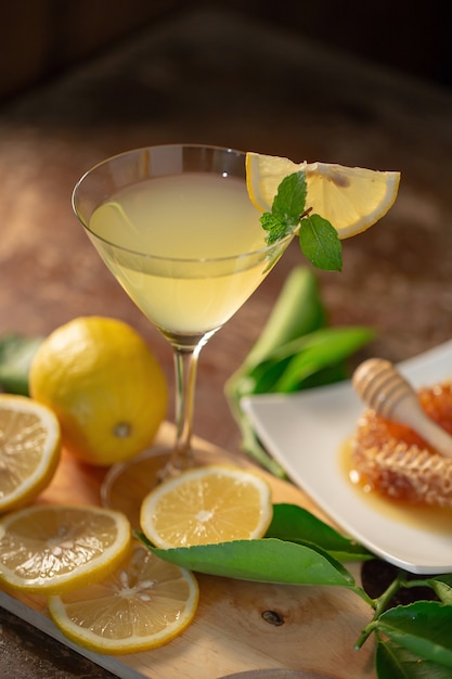 Lemon juice with honey on wooden table