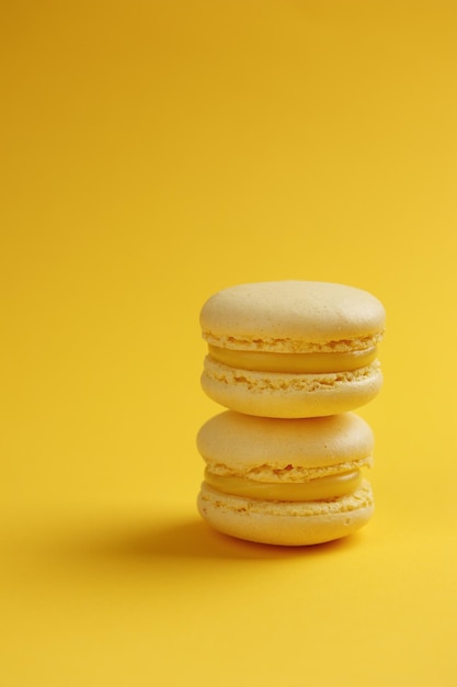 Lemon macaroons on a yellow background
