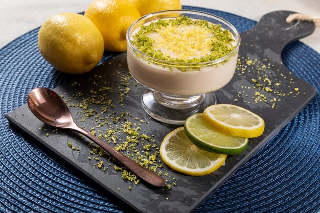 Lemon mousse in crystal bowl with lemon zest.