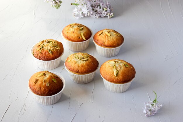 Lemon muffins sprinkled with chopped pistachios.