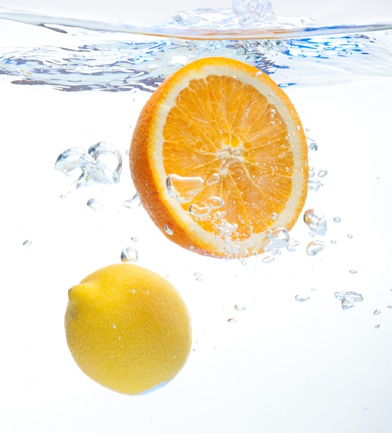 Lemon and orange in the water