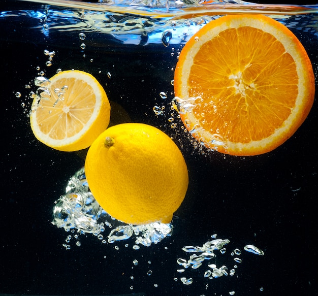 Lemon and orange in the water