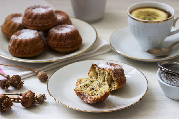 Lemon poppy biscuit muffins for tea on a light surface