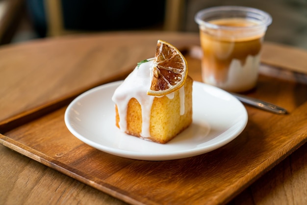 lemon pound cake on white plate in cafe and restaurant