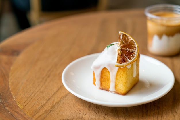 lemon pound cake on white plate in cafe and restaurant