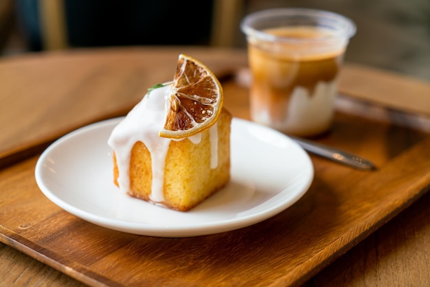 lemon pound cake on white plate in cafe and restaurant