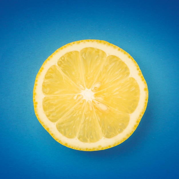 Lemon slice on blue background