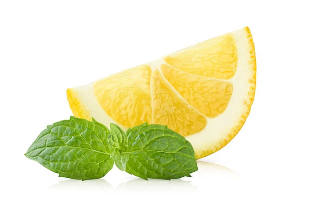 Lemon slice and fresh mint leaves on isolated white surface