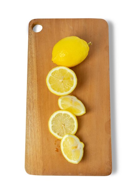 Lemon slices on cutting board isolated on white background Clipping path