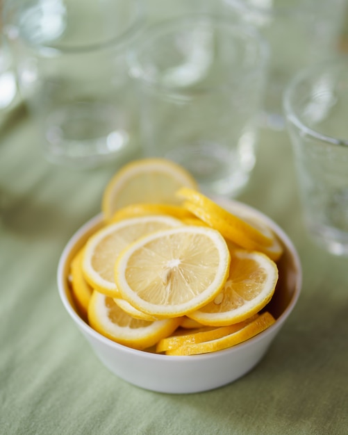 Lemon slices in a small bowl placed on the table