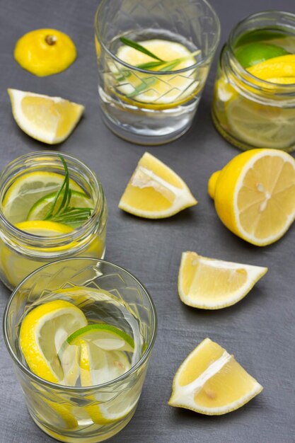 Lemon slices on table Glasses with summer lemon drink